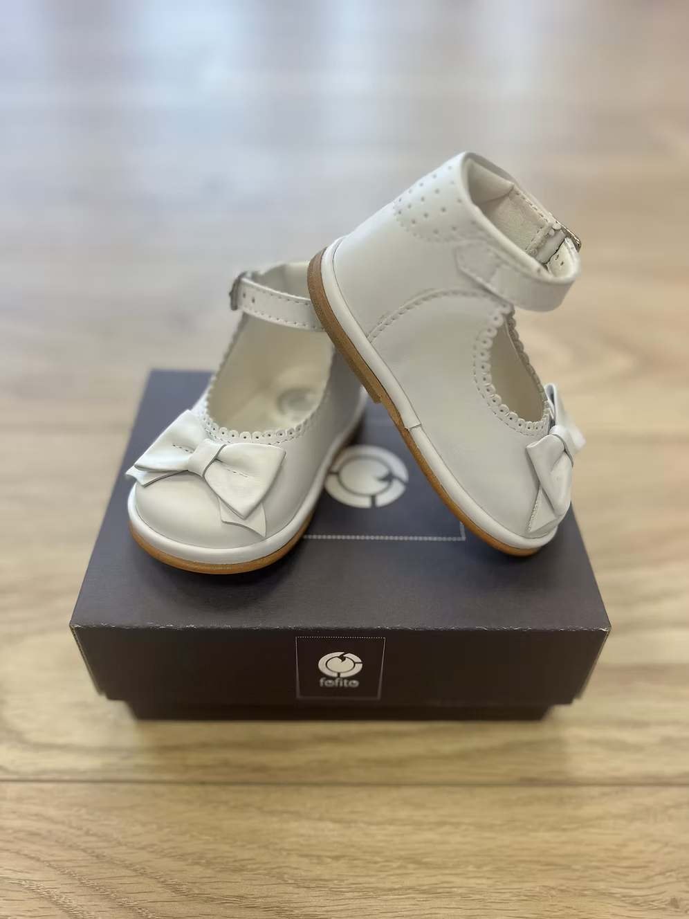 Fofito Ruby Bow Shoes featuring a classic bar shoe design, decorative bow detail, padded collar, cushioned insole and breathable lining.