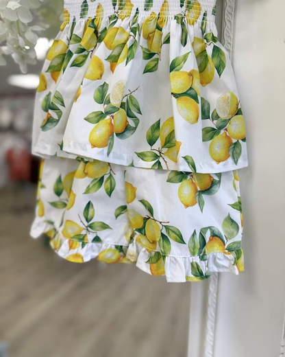 Deolinda Sorrento Short Set featuring a lemon print, stretchy smocked top, frill hem detail and matching shorts for girls.