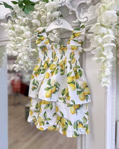 Deolinda Sorrento Short Set featuring a lemon print, stretchy smocked top, frill hem detail and matching shorts for girls.