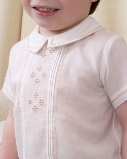 Sarah Louise x Little Lambs Heritage Boys Short Set featuring an ivory shirt with traditional detailing and tailored beige shorts.