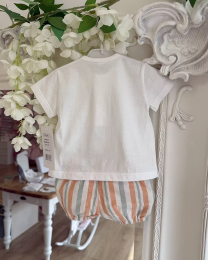 featuring striped shorts in soft off-white with pops of green and orange. Paired perfectly with a crisp white tee, finished with a simple wooden button neckline