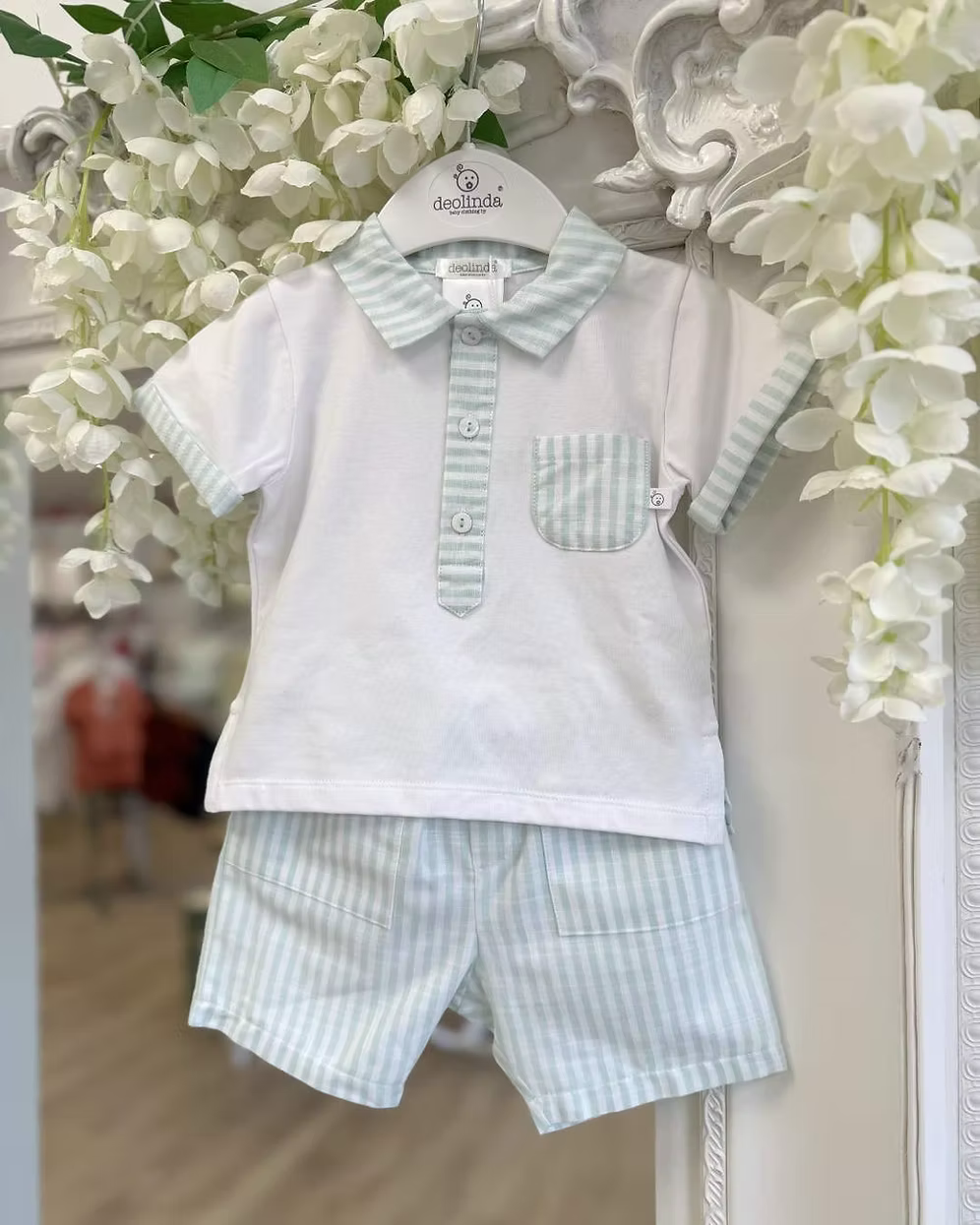 Deolinda Mint Stripe Short Set featuring a white polo top with mint stripe collar, pocket and trims, paired with matching mint striped shorts.