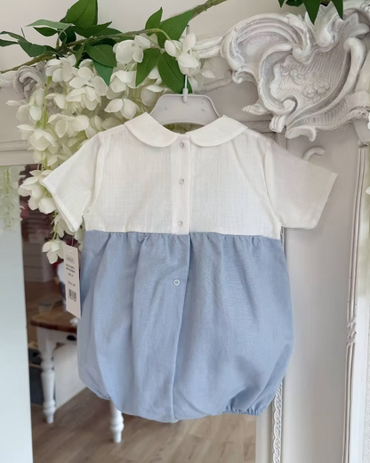 Baby romper with white top and blue bottom with back popper fastening