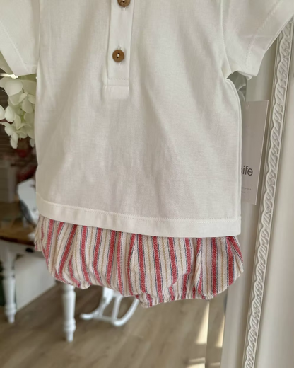 Designed with a linen-look striped short in a mix of red, blue, camel and soft off-white tones. Paired with a crisp white tee, finished with a contrasting striped trim to the neckline and classic wooden button detailing.