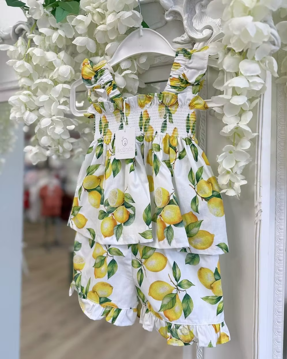 Deolinda Sorrento Short Set featuring a lemon print, stretchy smocked top, frill hem detail and matching shorts for girls.
