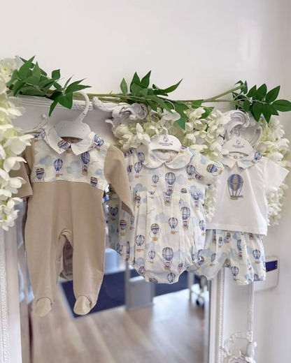 Deolinda Air Balloon Babygrow featuring a hot air balloon and bear print, neutral lower half, Peter Pan collar and popper fastening.