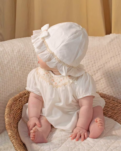 Sarah Louise x Little Lambs Heritage Ruffle Hat featuring soft ivory fabric, delicate ruffle trim and subtle embroidered detailing.