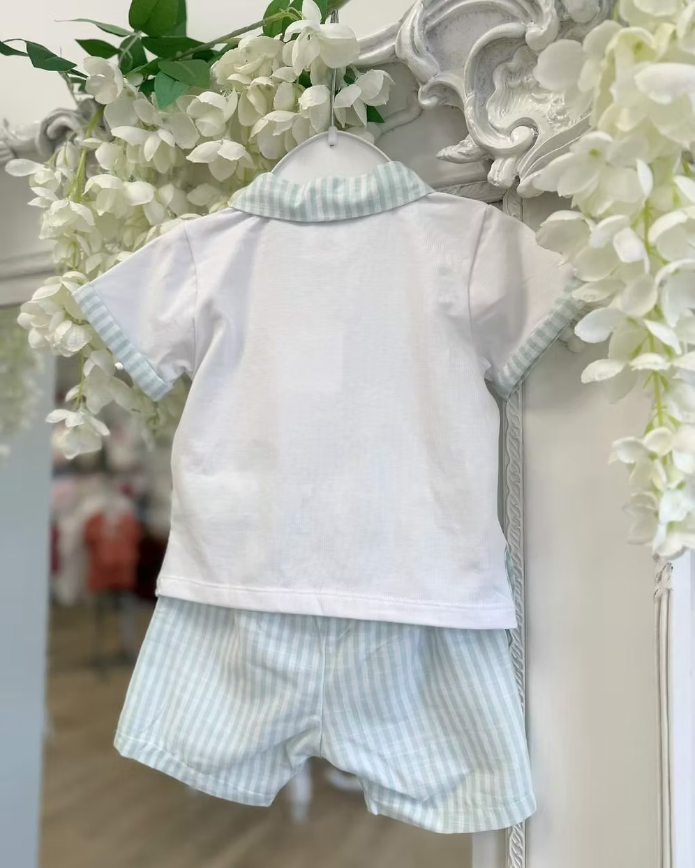 Deolinda Mint Stripe Short Set featuring a white polo top with mint stripe collar, pocket and trims, paired with matching mint striped shorts.