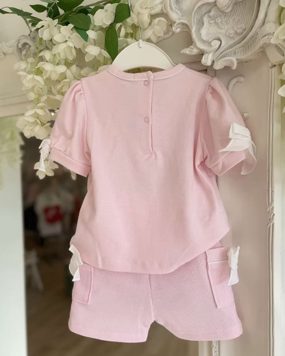 Bluesbaby Pia Pink Bow Short Set featuring a soft pink cotton top with puff sleeves, waffle shorts and contrasting white bow details.