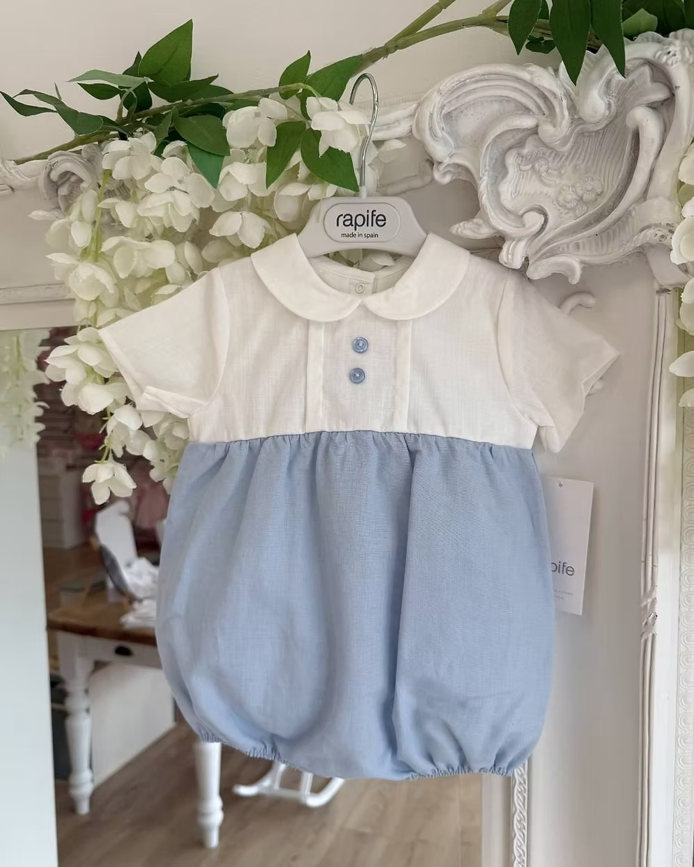 Baby romper with white top and blue bottom
