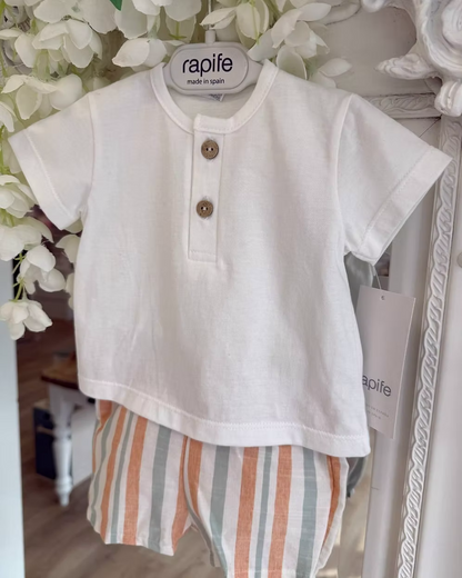 featuring striped shorts in soft off-white with pops of green and orange. Paired perfectly with a crisp white tee, finished with a simple wooden button neckline