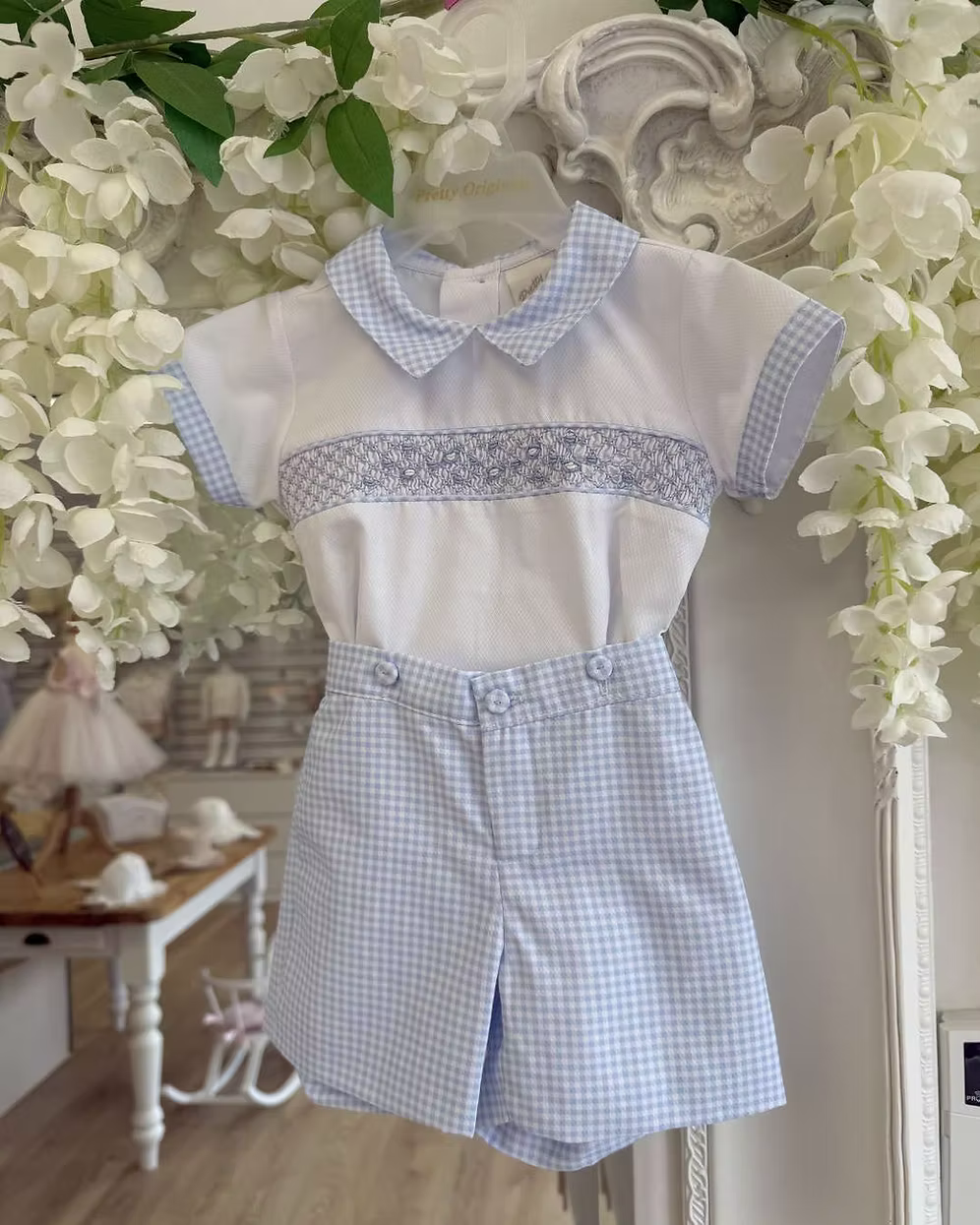 Pretty Originals Harry Gingham Short Set featuring blue and white gingham shorts, hand-smocked embroidered shirt and matching gingham trims.