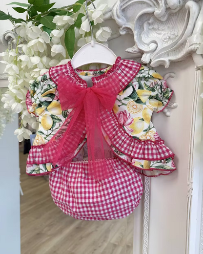 Babine Lemon Blossom Swing Back Dress & Pants featuring a lemon and pink floral print, open swing back, large tulle bow, frill collar, and matching pink gingham pants.