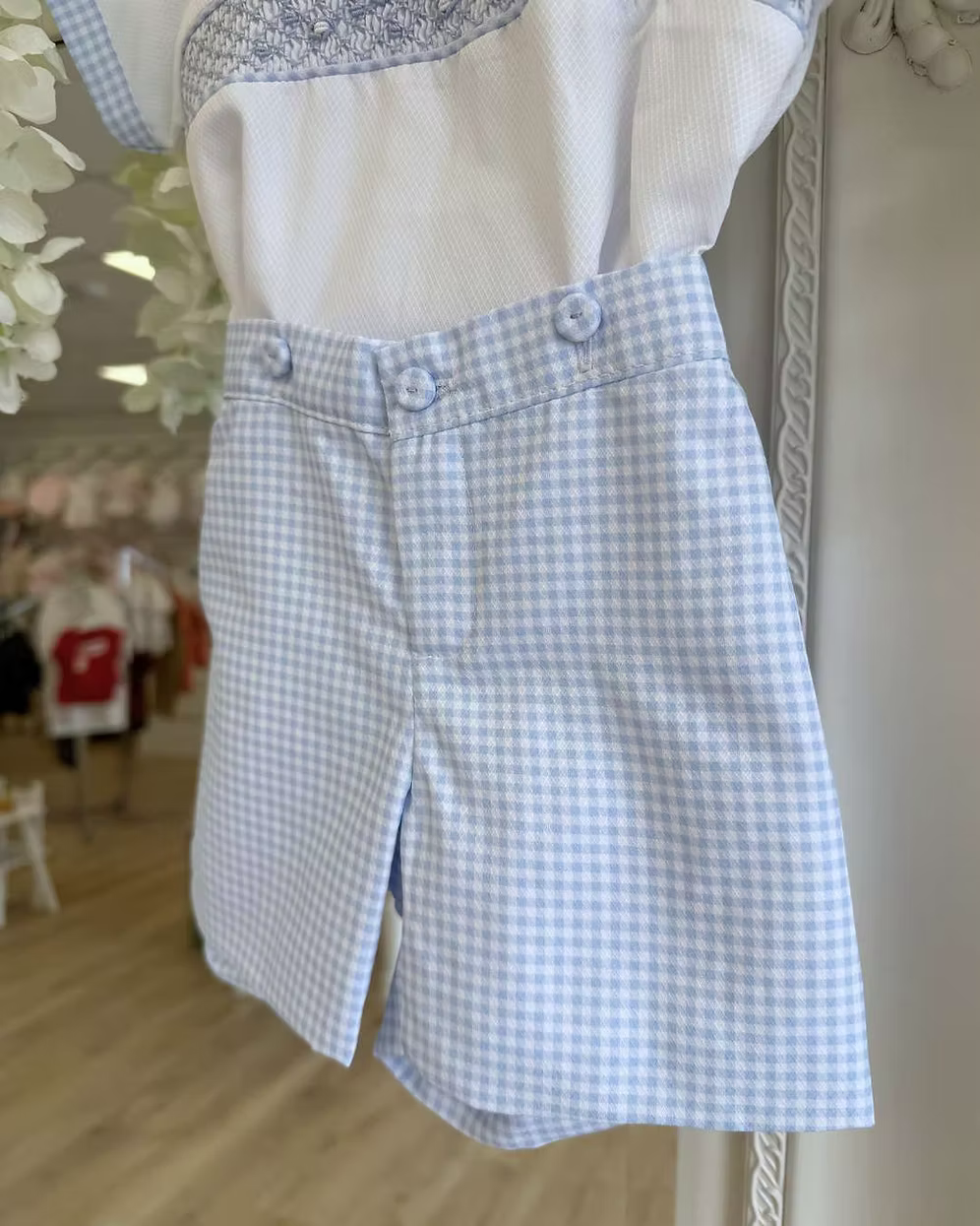 Pretty Originals Harry Gingham Short Set featuring blue and white gingham shorts, hand-smocked embroidered shirt and matching gingham trims.