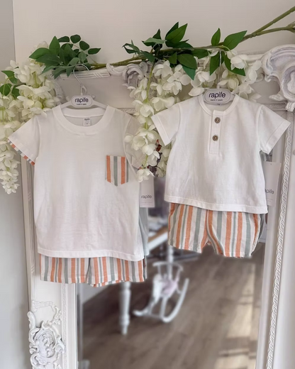 featuring striped shorts in soft off-white with pops of green and orange. Paired perfectly with a crisp white tee, finished with a simple wooden button neckline
