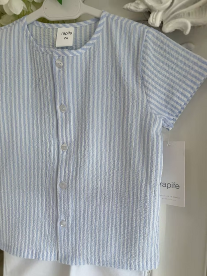 Blue and white striped shirt with white shorts