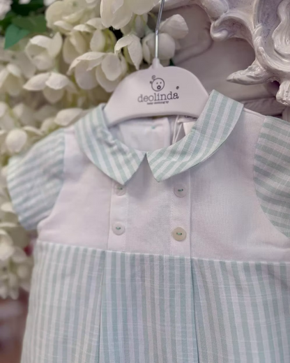 Deolinda Mint Stripe Romper featuring pastel mint stripes, a white chest panel, pointed collar, button detailing and a classic summer design.