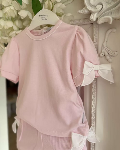 Bluesbaby Pia Pink Bow Short Set featuring a soft pink cotton top with puff sleeves, waffle shorts and contrasting white bow details.
