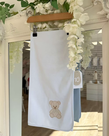 Baby Gi Teddy Shawl featuring soft cotton fabric, embroidered teddy bear detail and available in ivory, pink and blue colourways.