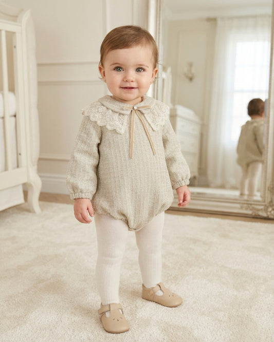 BeChic Florence beige tweed baby girls romper with ivory floral lace collar, velvet bow, decorative gold button and long sleeves.